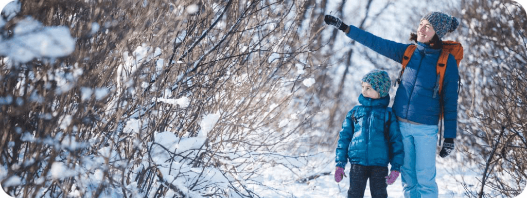 A mother shows her son the wonders of Door County in the winter