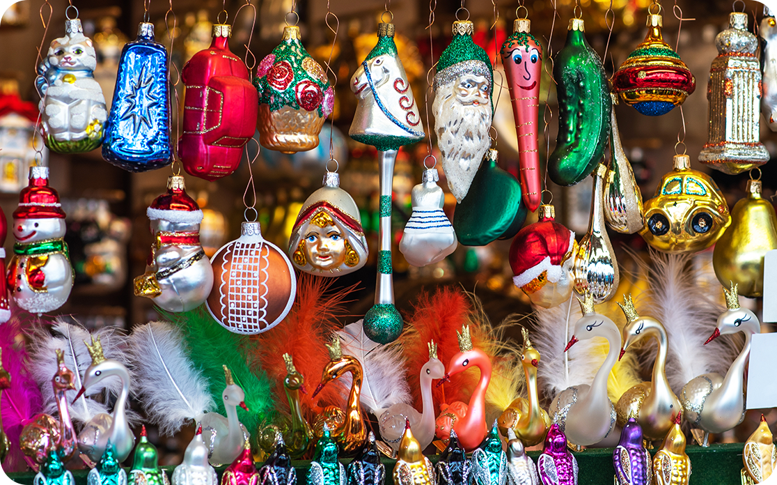 Traditional Christmas ornaments hang at a vendor at a Christkindlmarkt