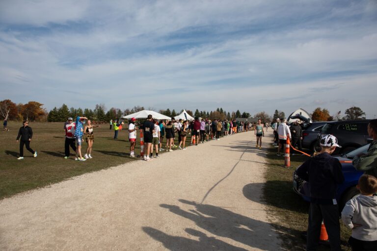 Relay runners waiting along the chute at Fall 50 Exchange 1