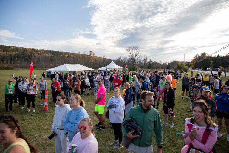 Crowd of costumed relay runners waiting at Fall 50 Exchange 8