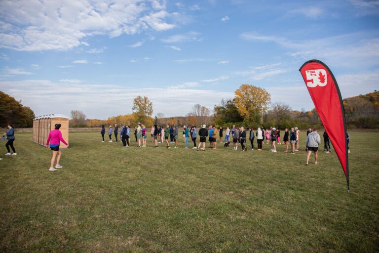 Line for porta-potties at a Fall 50 exchange