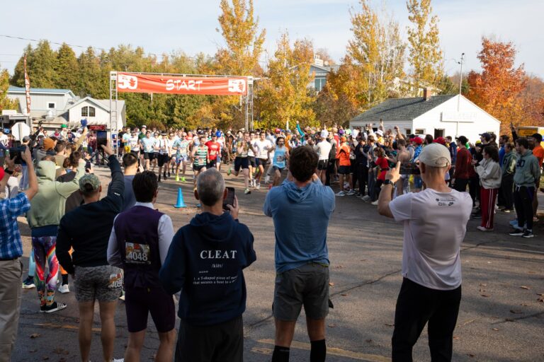 Fall 50 team relay runners leaving the start line in Gills Rock
