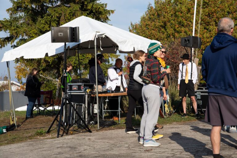DJ and costumed volunteers at the Fall 50 start in Gills Rock