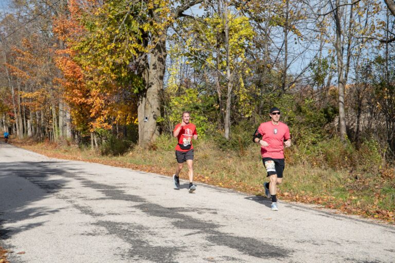 Two Fall 50 runners in red on Leg 5 near Fish Creek